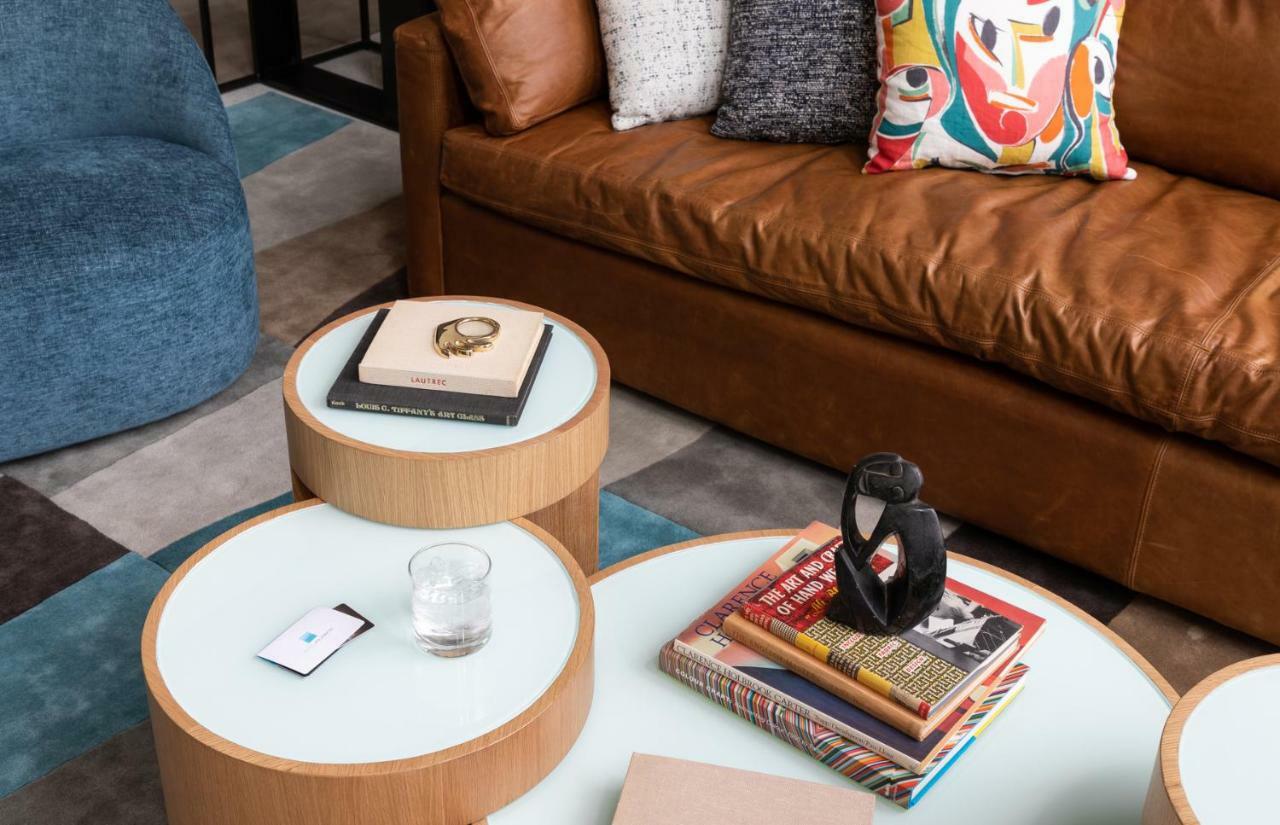Hotel Murano Tacoma Bagian luar foto A coffee table with a stack of books